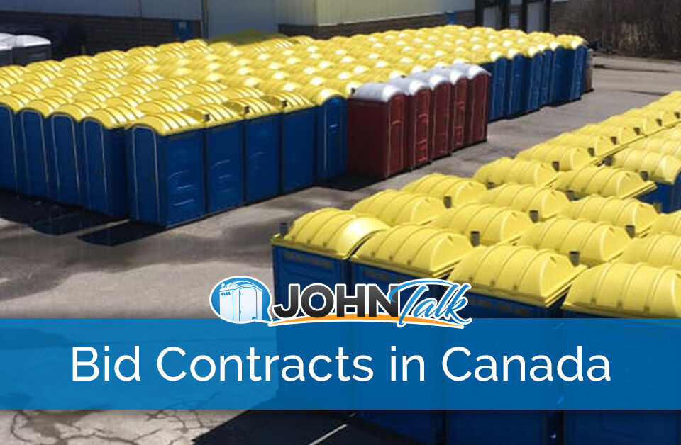 A business yard with many portable toilets in several different colors