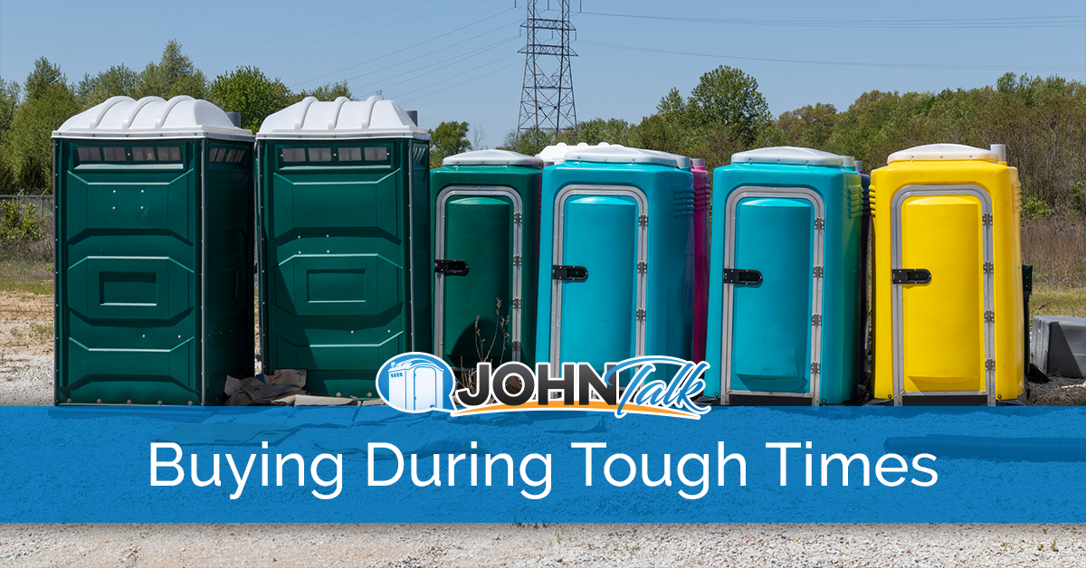 A group of portable toilets in a warehouse yard