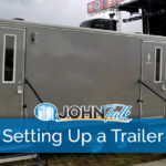 A portable restroom trailer at an outdoor concert venue
