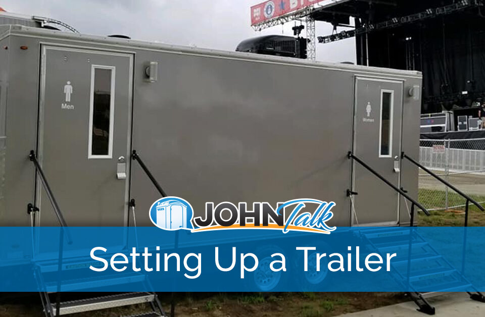 A restroom trailer at an outdoor concert venue