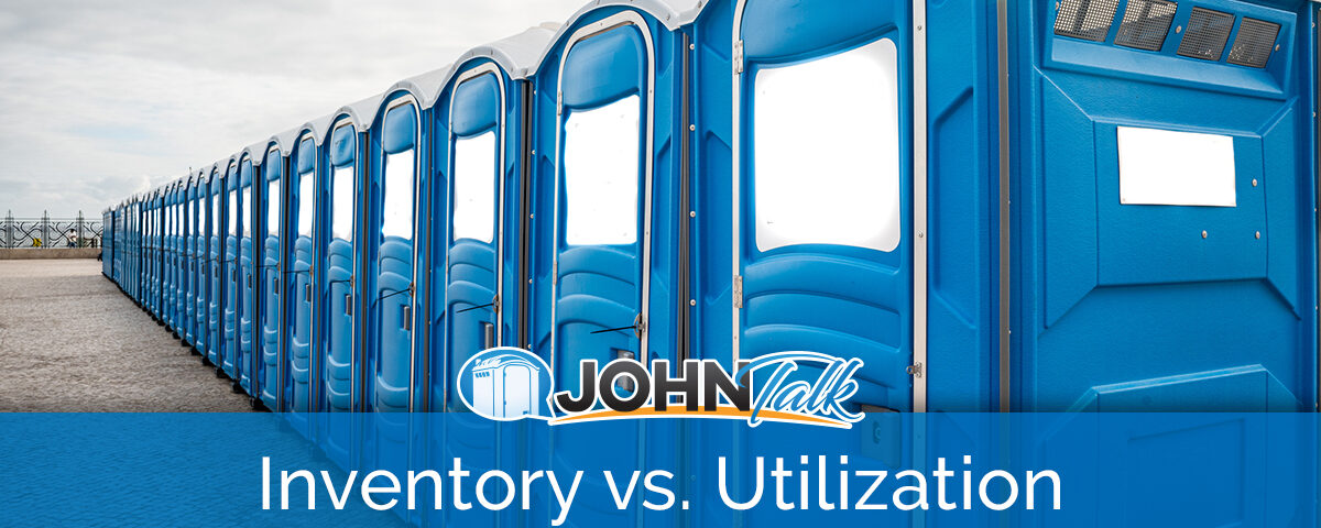 A row of blue portable toilets