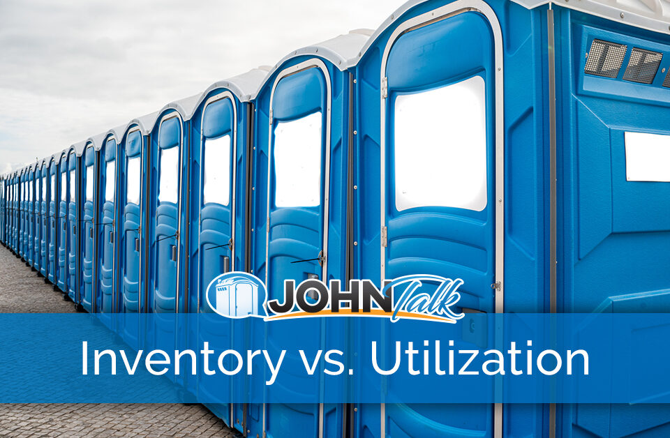 A row of blue portable toilets